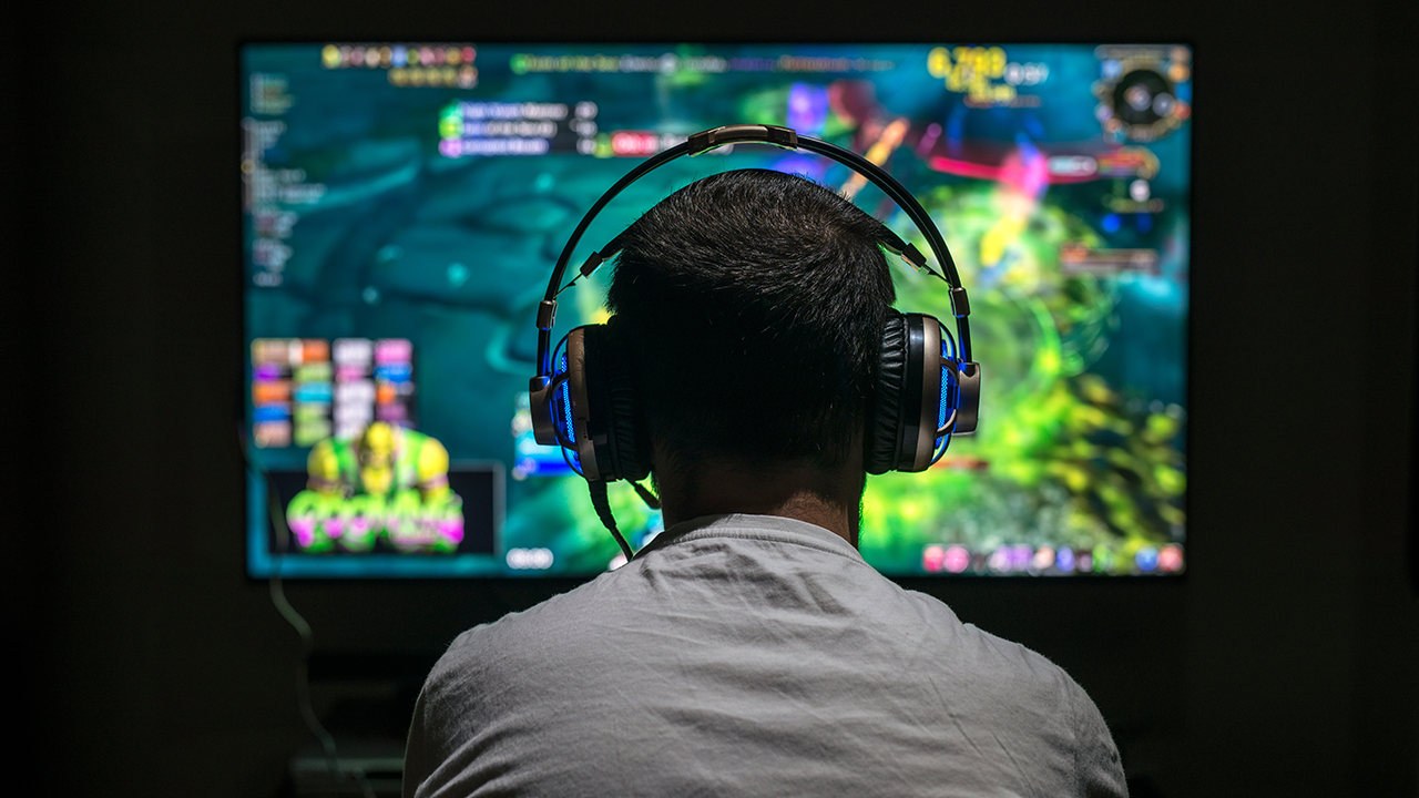 Game designer enhancing level visuals using design software.